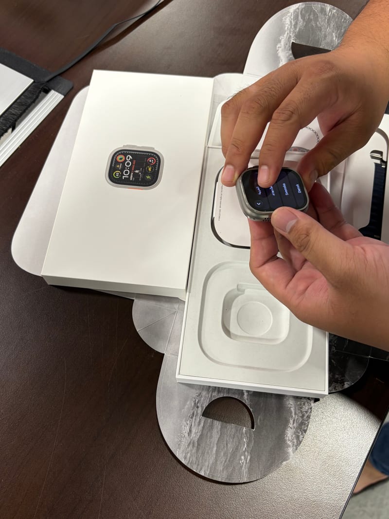 Unboxing an Apple Watch Ultra from its packaging during a Berry Nice inspection