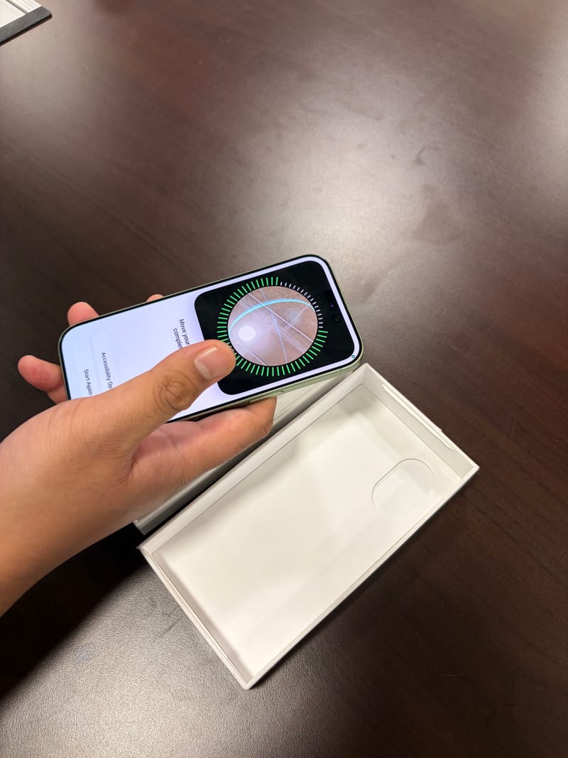 Setting up Face ID on a green iPhone during the Berry Nice inspection process