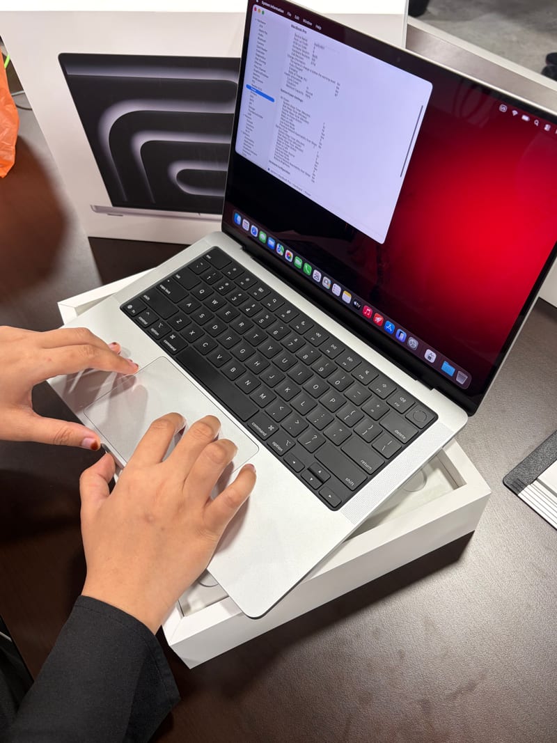 Berry Nice inspecting a laptop during buyback in Sentul, KL